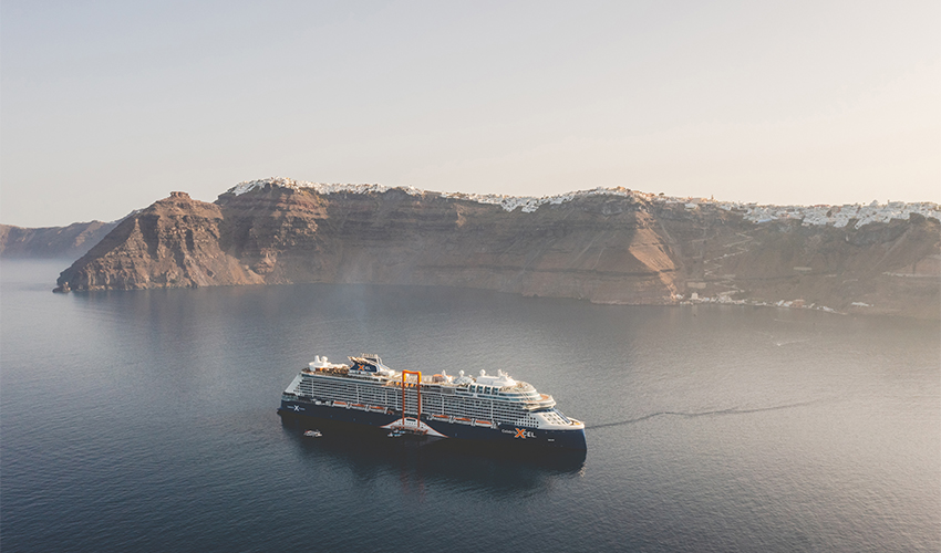 Celebrity Cruises® - Aerial view of a Celebrity Cruise ship in the Santorini caldera