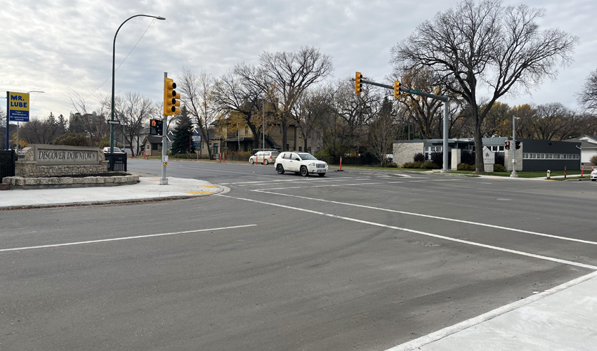 Manitoba newly paved road at a traffic light.