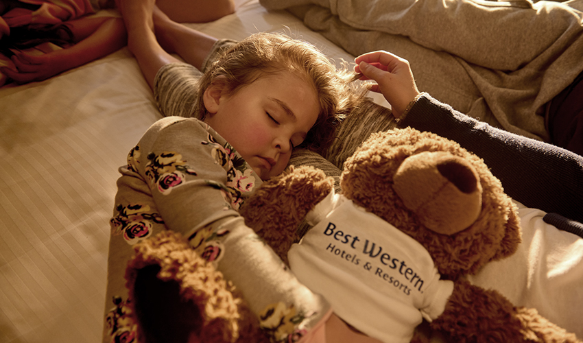 blog-img--small-child-hugging-a-bear-with-best-western-t-shirt-while-sleeping
