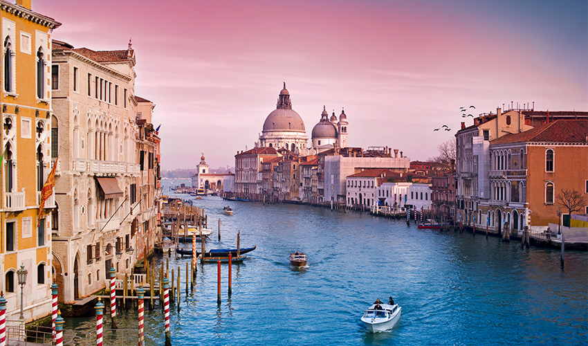 Viking Cruises® - Panoramic view of gondolas in the Grand Canal of Venice at sunset