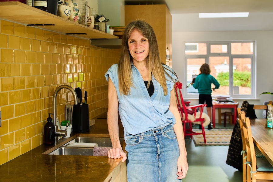 Lauren, accountant with Full Stop Accounts, standing in her kitchen.