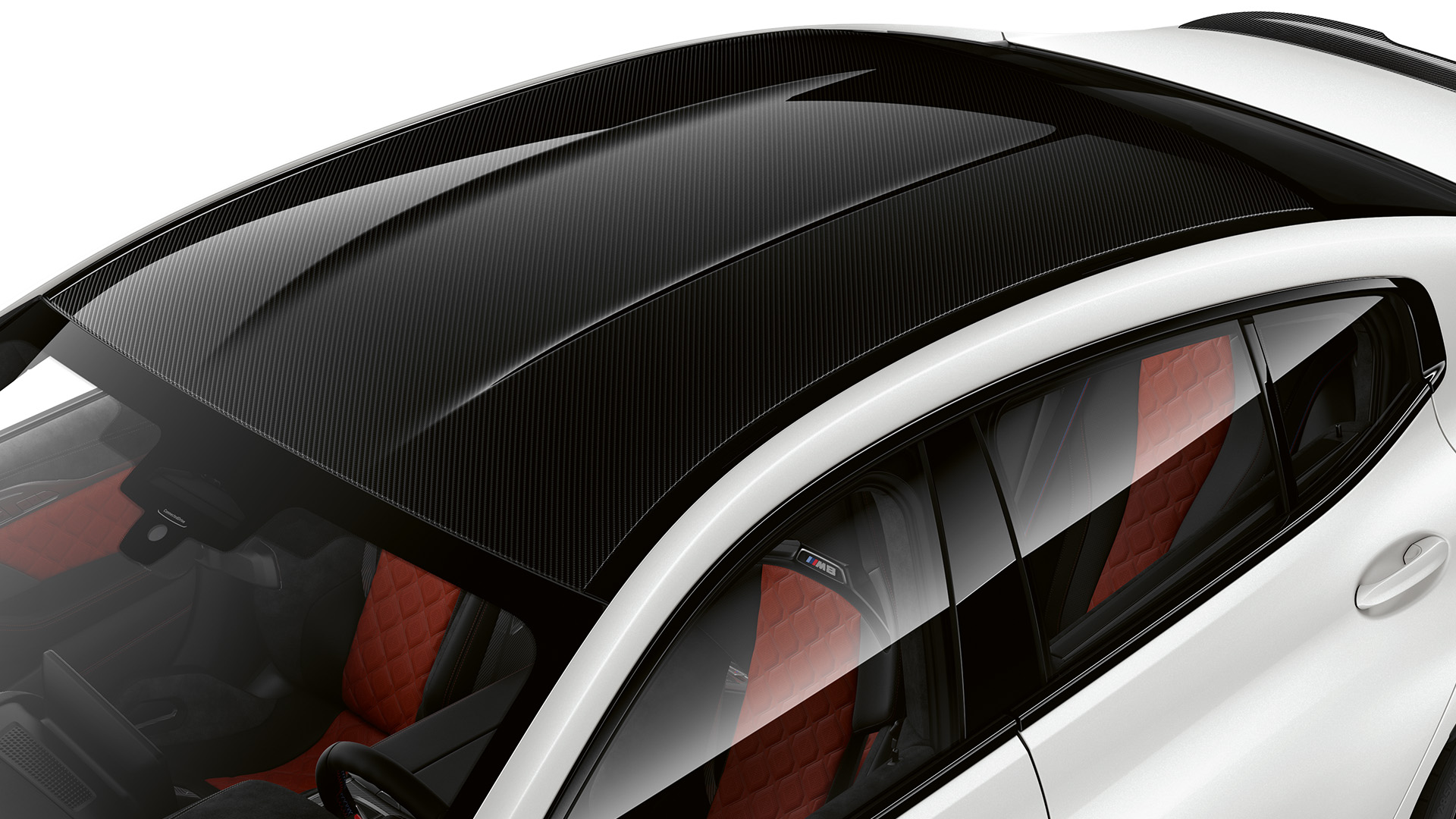 Top view of a white car with a black carbon fiber roof and red quilted interior seats.