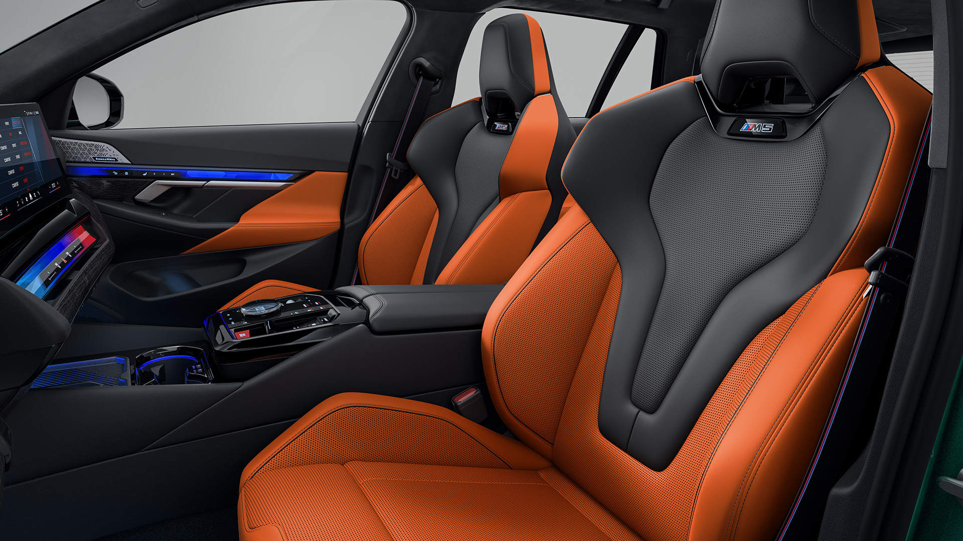 Interior of a modern car featuring orange and black leather seats, a sleek dashboard with a digital display, and ambient lighting.