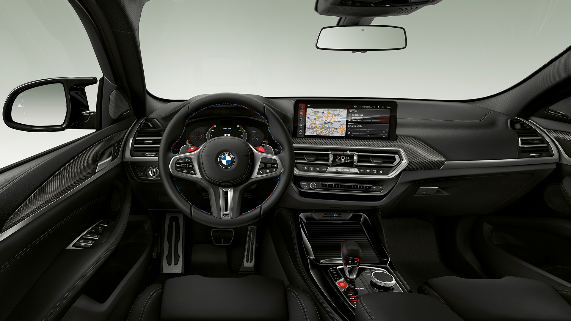 Interior view of a BMW car showing the steering wheel, dashboard, and infotainment system with a navigation map displayed on the screen.