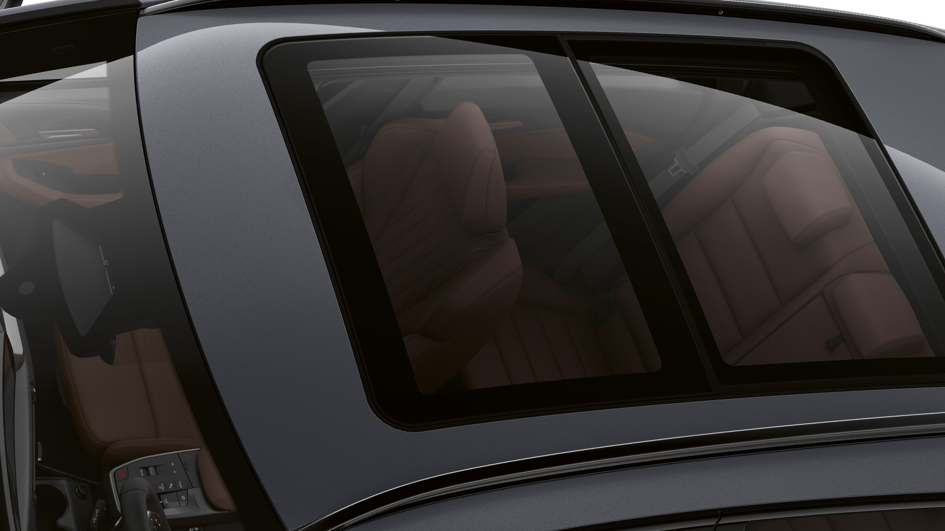 Top view of a gray BMW car with a panoramic sunroof showing the interior seats.