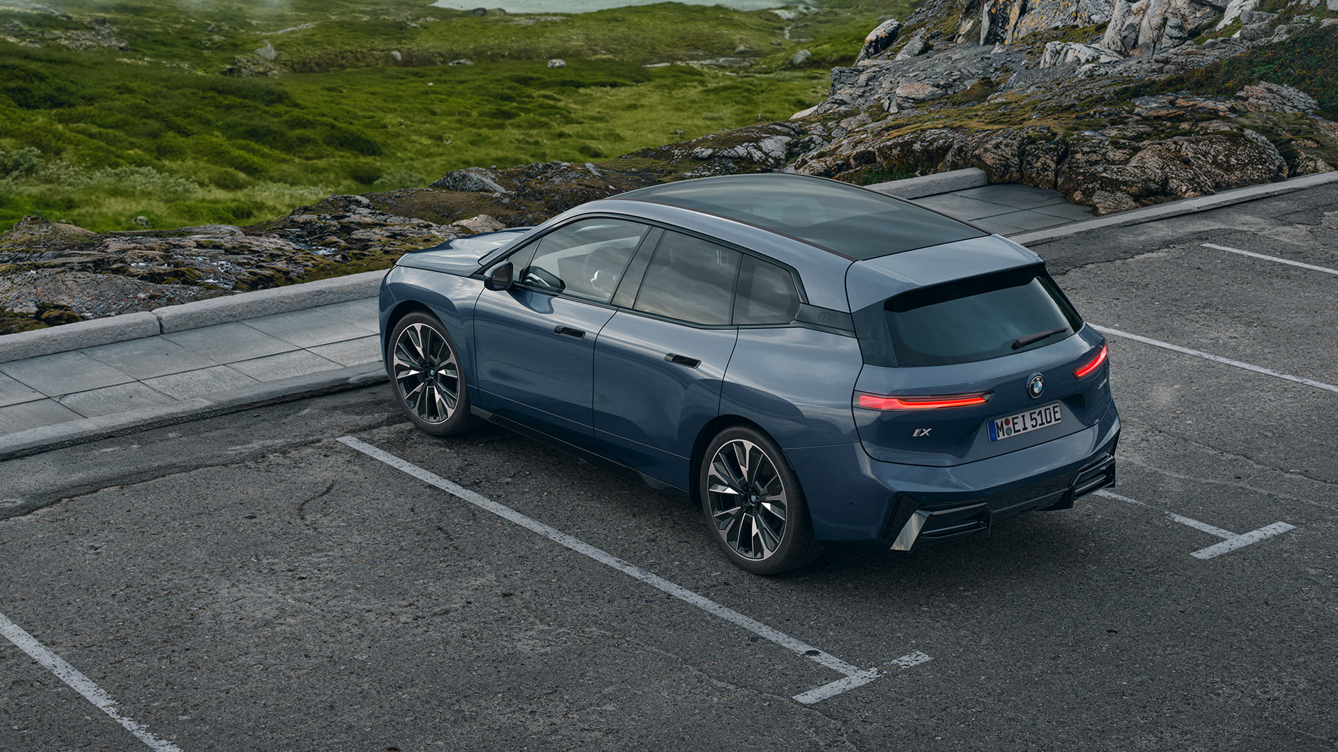Dark blue BMW iX parked
