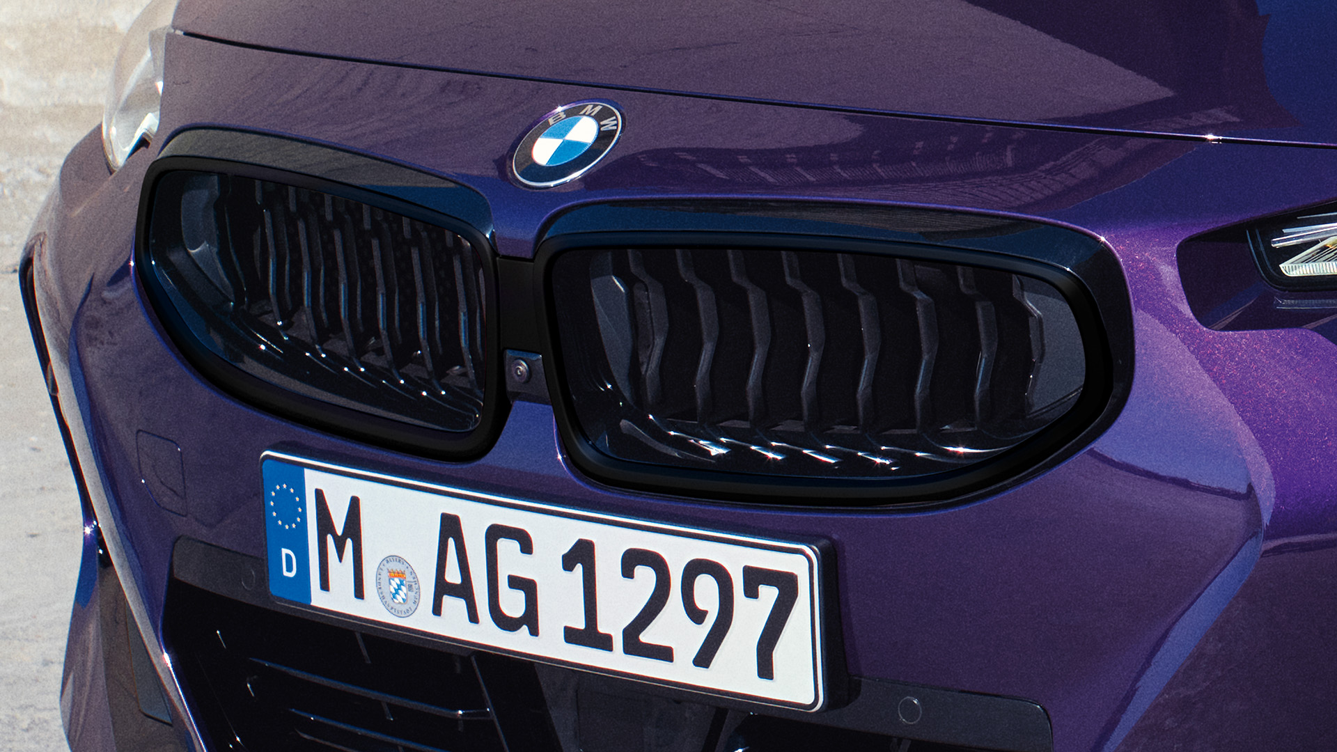 Front view of a purple BMW car.