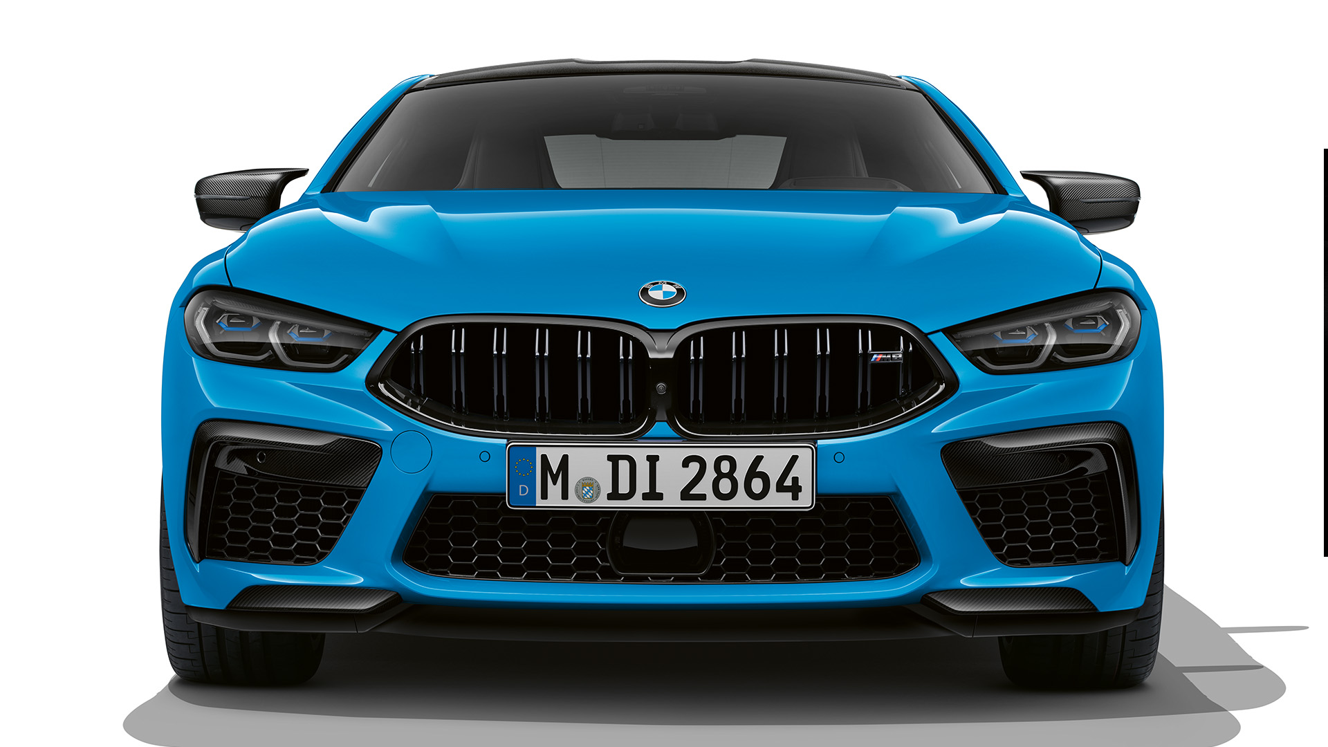 Front view of a blue BMW M8 car.