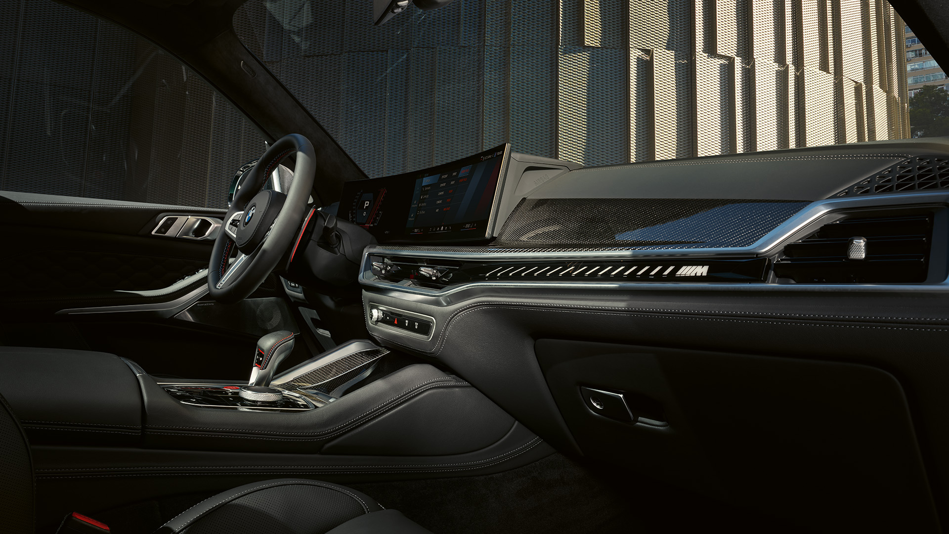 Interior view of a modern car showcasing the dashboard, steering wheel, and center console with a sleek design and advanced technology features.