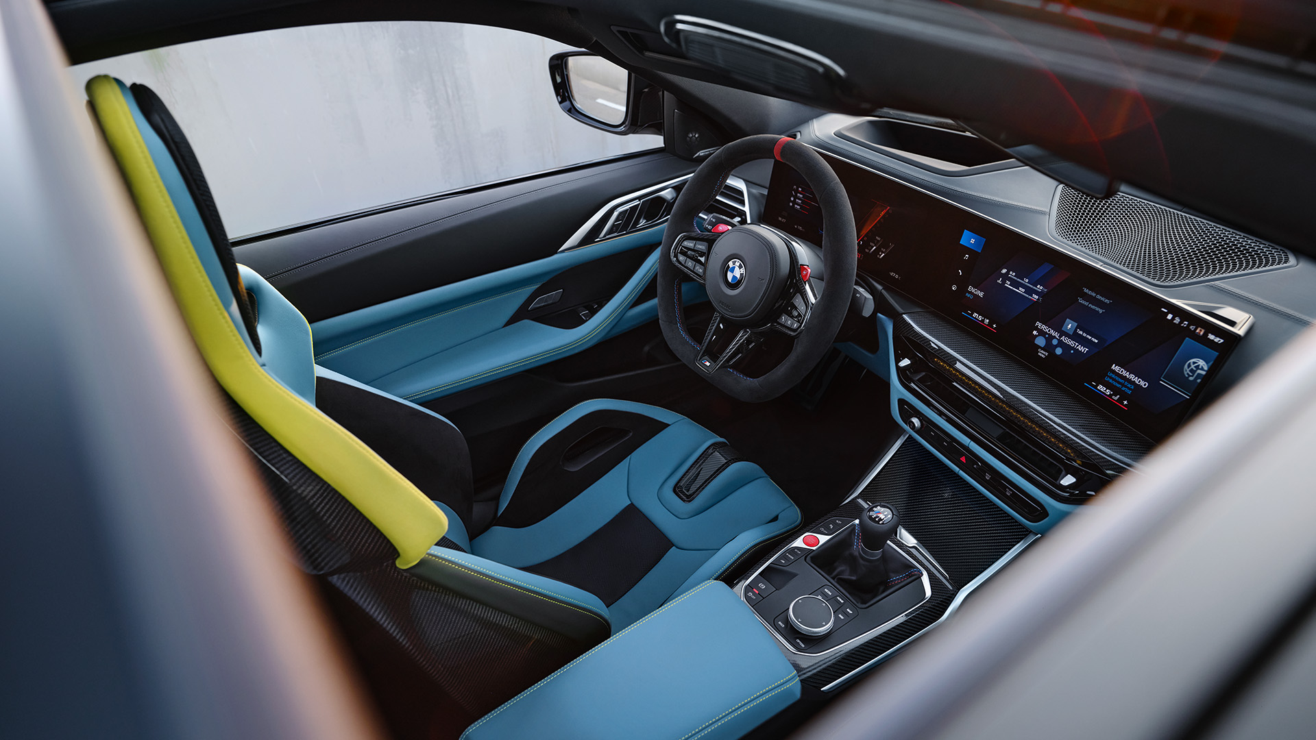 Interior of a modern BMW car showcasing the driver's seat, steering wheel with BMW logo, and advanced dashboard with digital displays.