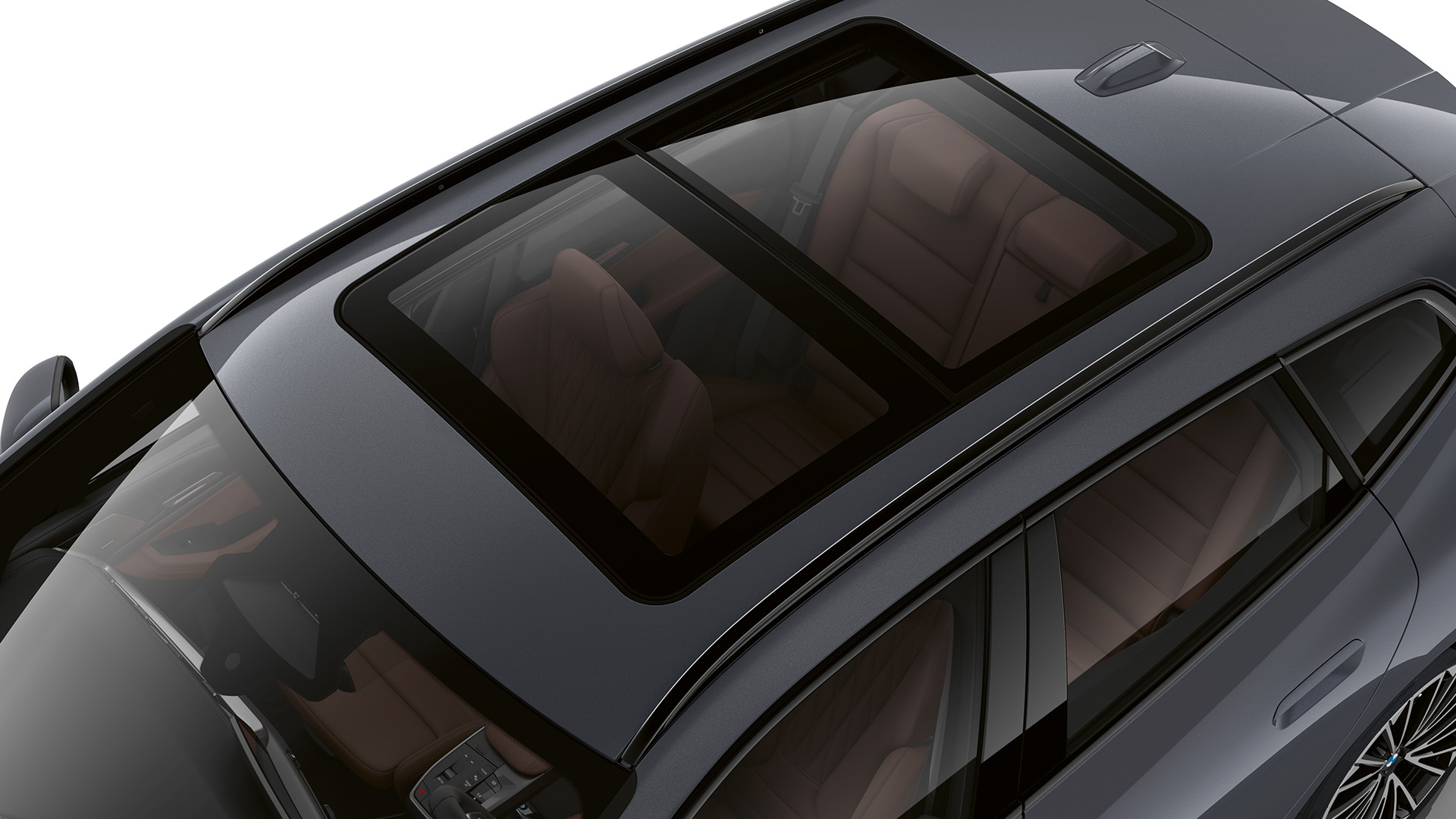 Top view of a gray BMW car with a panoramic sunroof showing the interior seats.