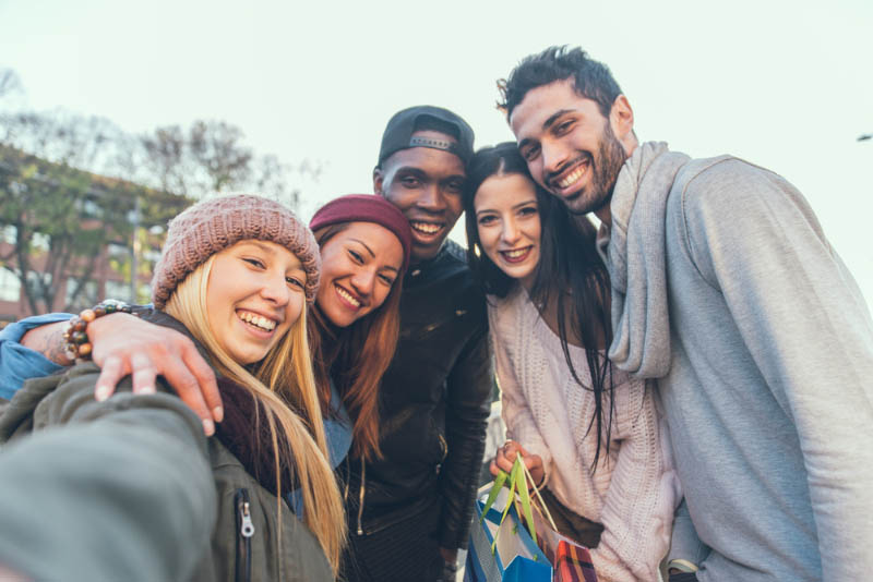 group of young people taking a selfie