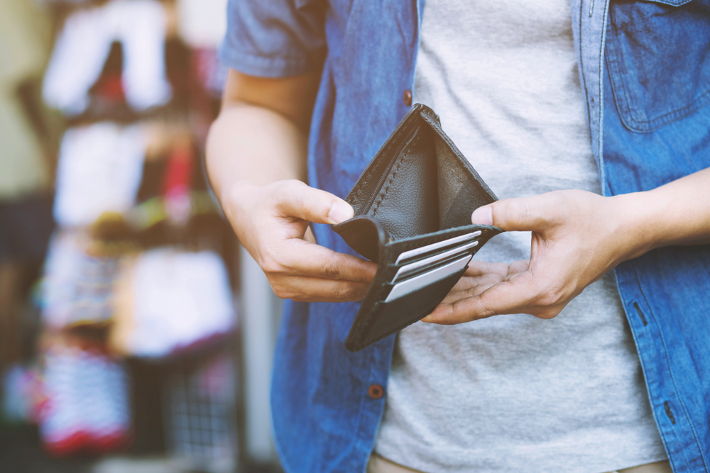 Man with empty wallet