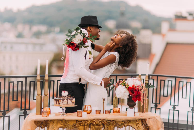 man and woman celebrating wedding in city