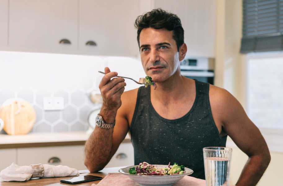 Man eating a salad 