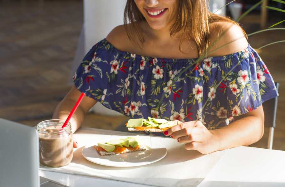 woman eating food at table indoors alba