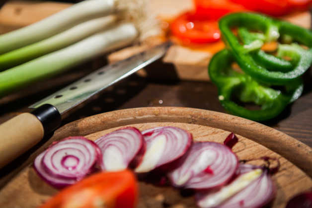 knife with sliced onions & bell peppers 