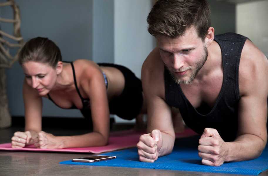 Couple, pair doing planks, man and woman, beard 