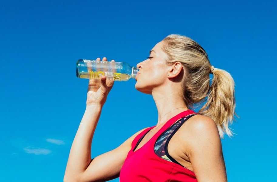 Blonde woman, female, drinking water