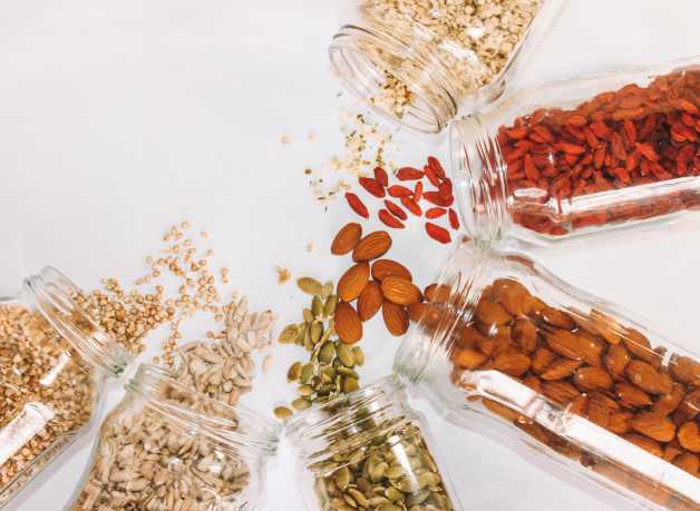grains, nuts and berries in jars
