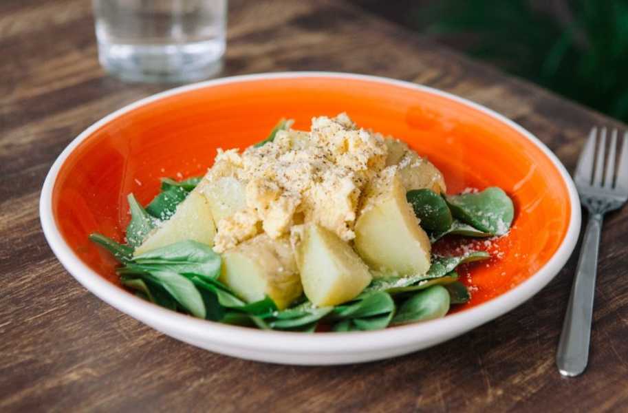 microwave potato with scrambled eggs and salad