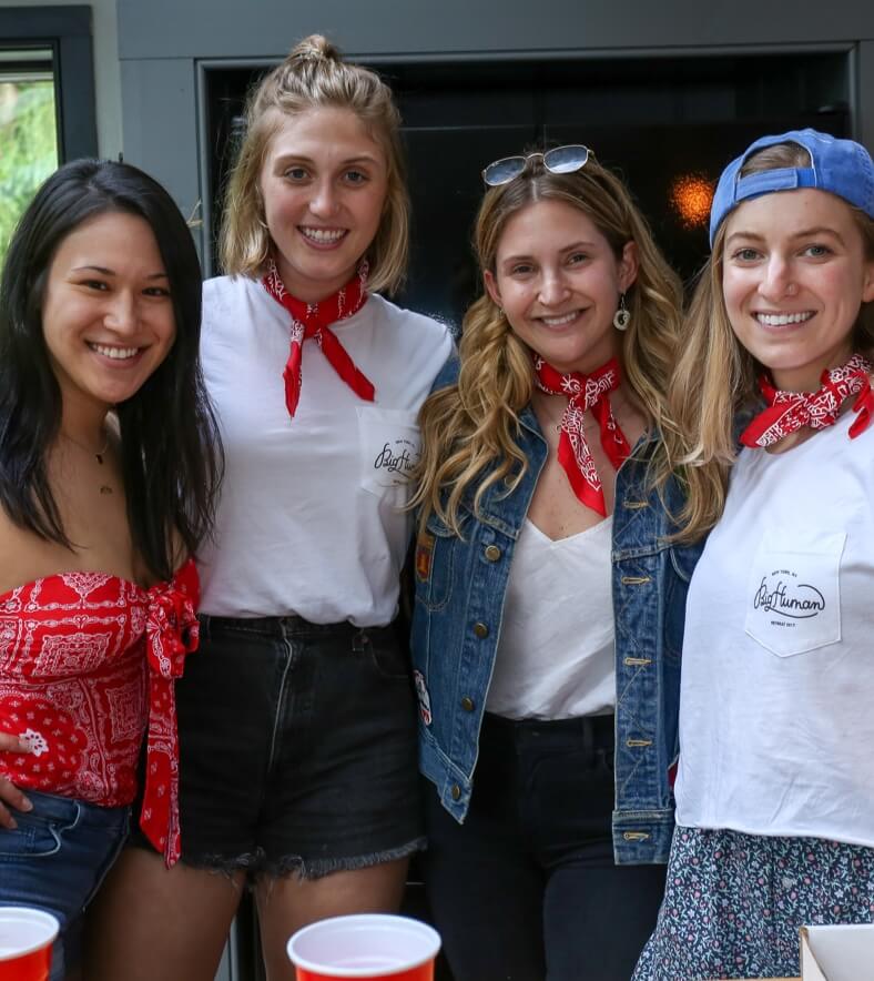 group of friends wearing red bandanas