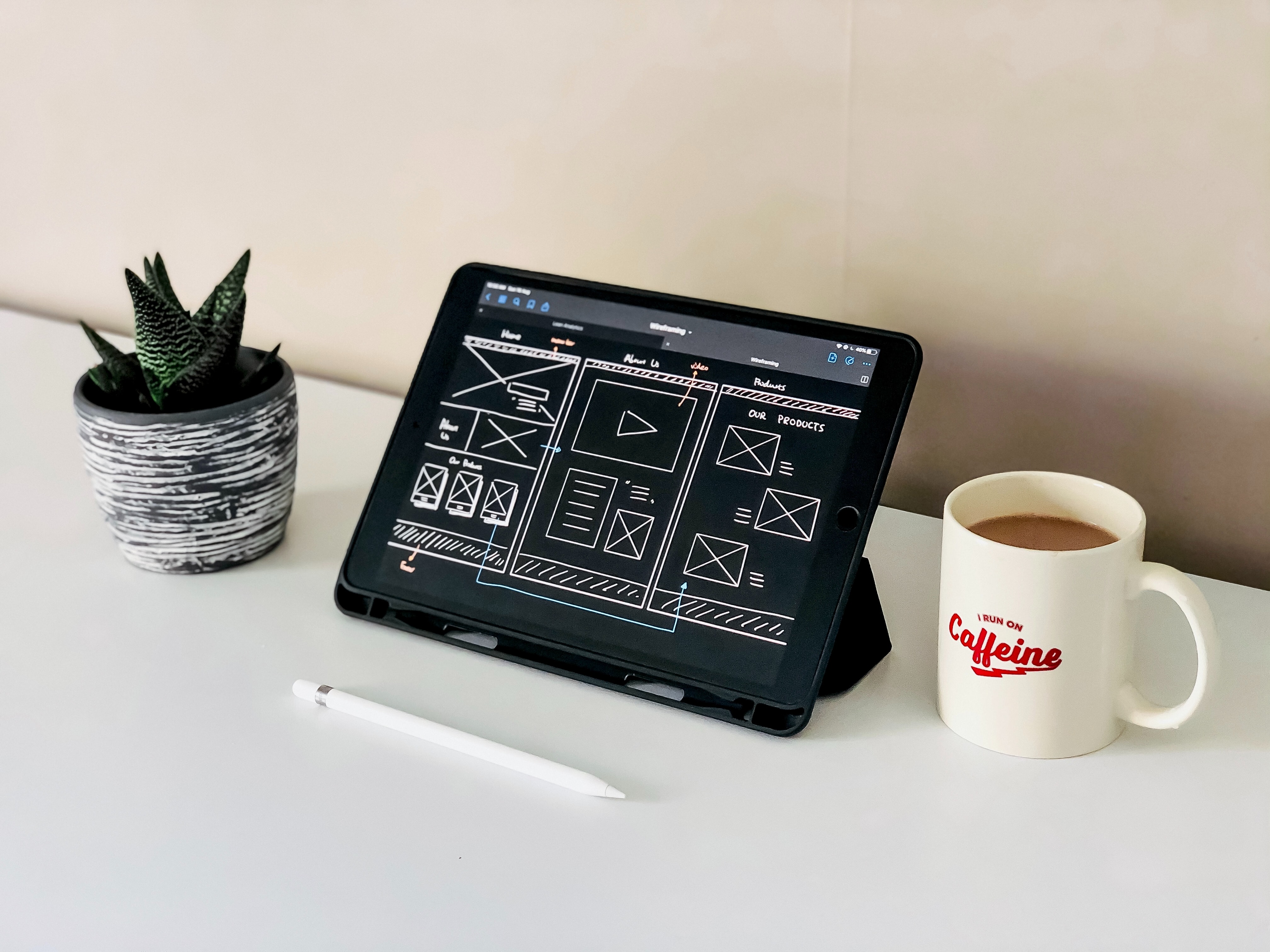 Hand-drawn wireframes on a tablet