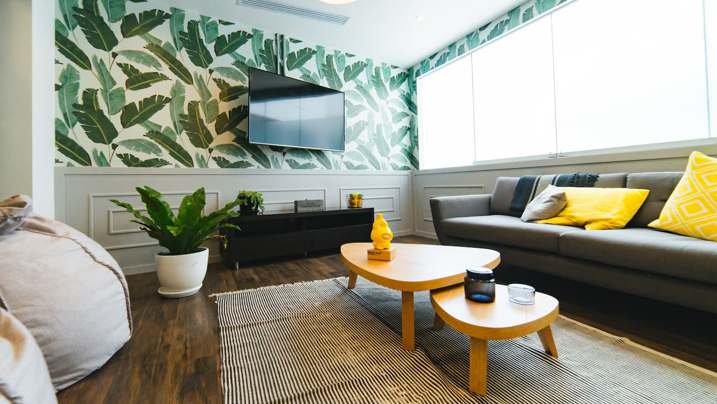 Turnkey real estate investment refers to buying properties ready-to-rent or with tenants already in place, so that the investor, often buying long-distance, earns rental income from day one. Image shows a stylish living room.