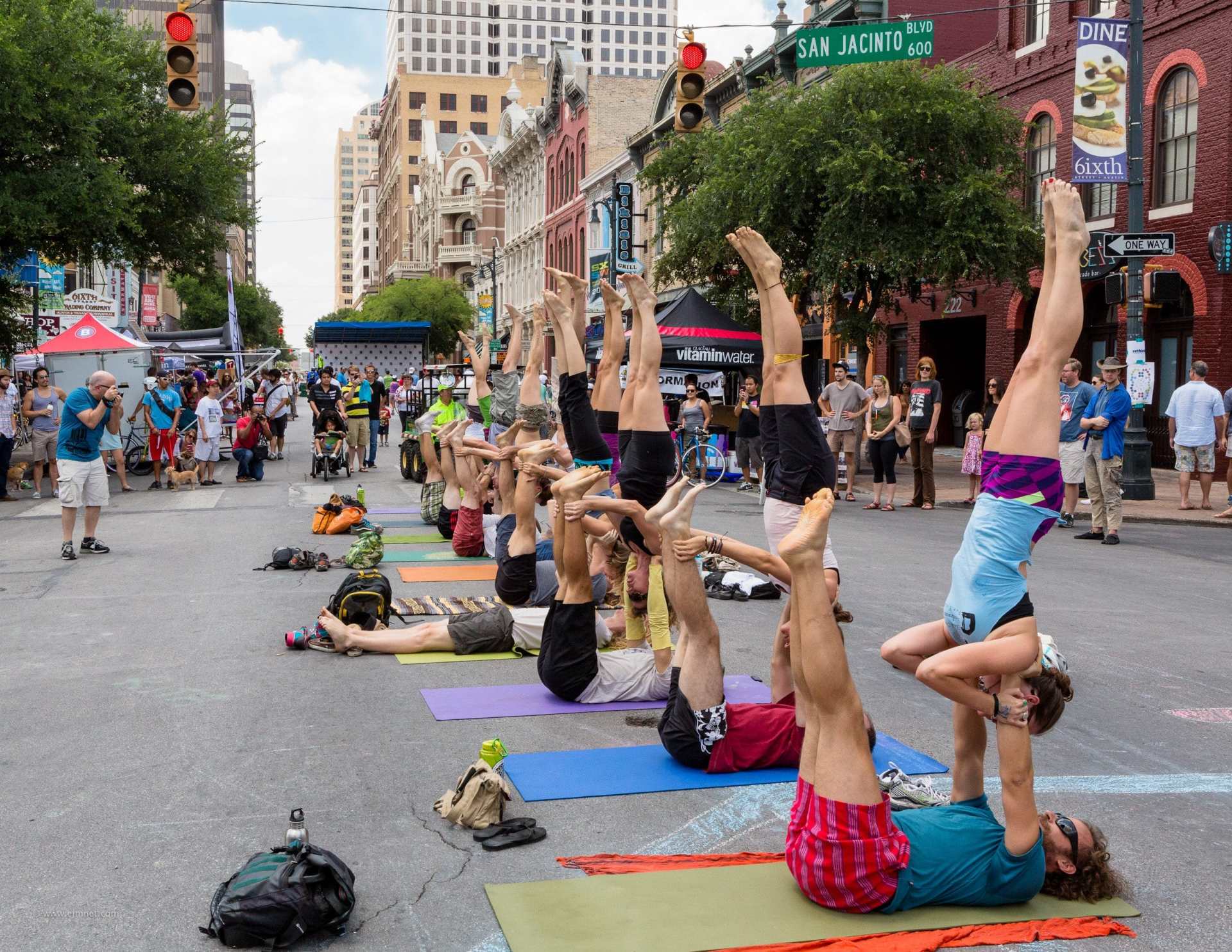 Young professionals gather in downtown Austin for an AcroYoga flashmob, typical of the cultural happenings Austin has to offer. (Credit: Wikimedia Commons/Earl McGehee)
