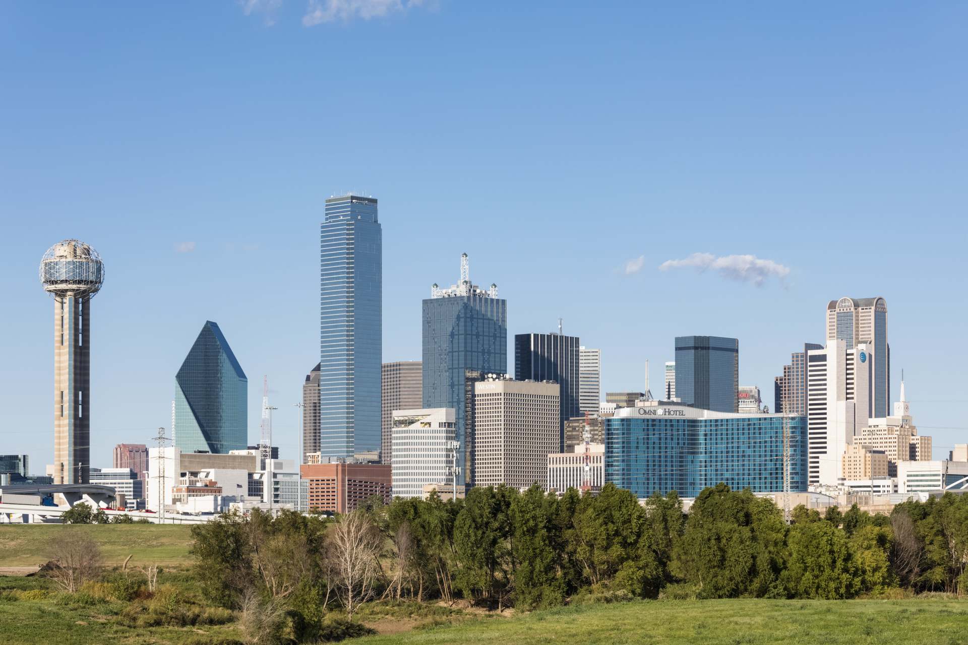 Real estate investing in Dallas, Texas. Image shows Dallas skyline. 