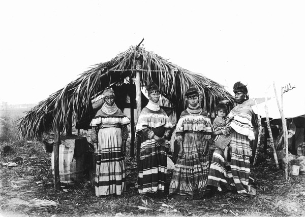 Pictured is the family of Seminole tribal elder, Cypress Tiger, at their camp near Kendall, Florida, 1916. Orlando was originally settled by the Timucua and Seminole peoples. (Credit: Wikimedia Commons; Original photographer: John Kunkel Small)
