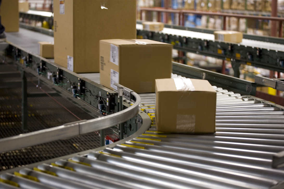 return packages on conveyor-GettyImages-1600x800