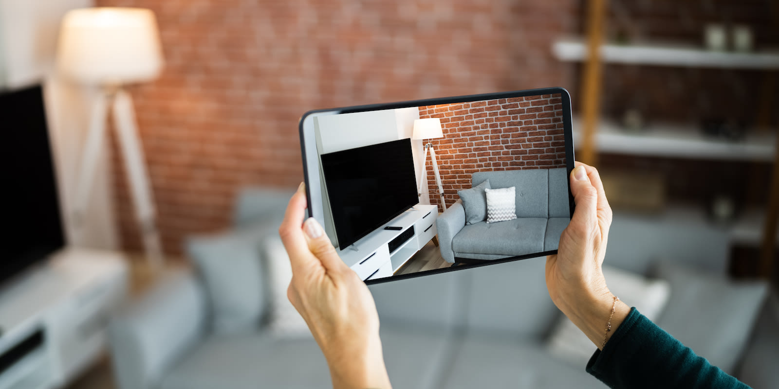 Furniture being viewed through a tablet. Masthead for durables goods research report.