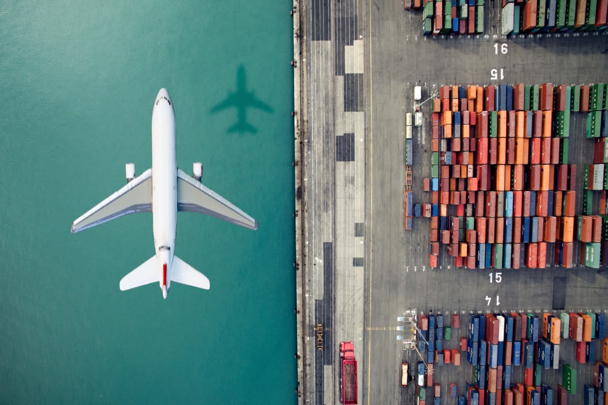 Airplane over a port GettyImages-636036276