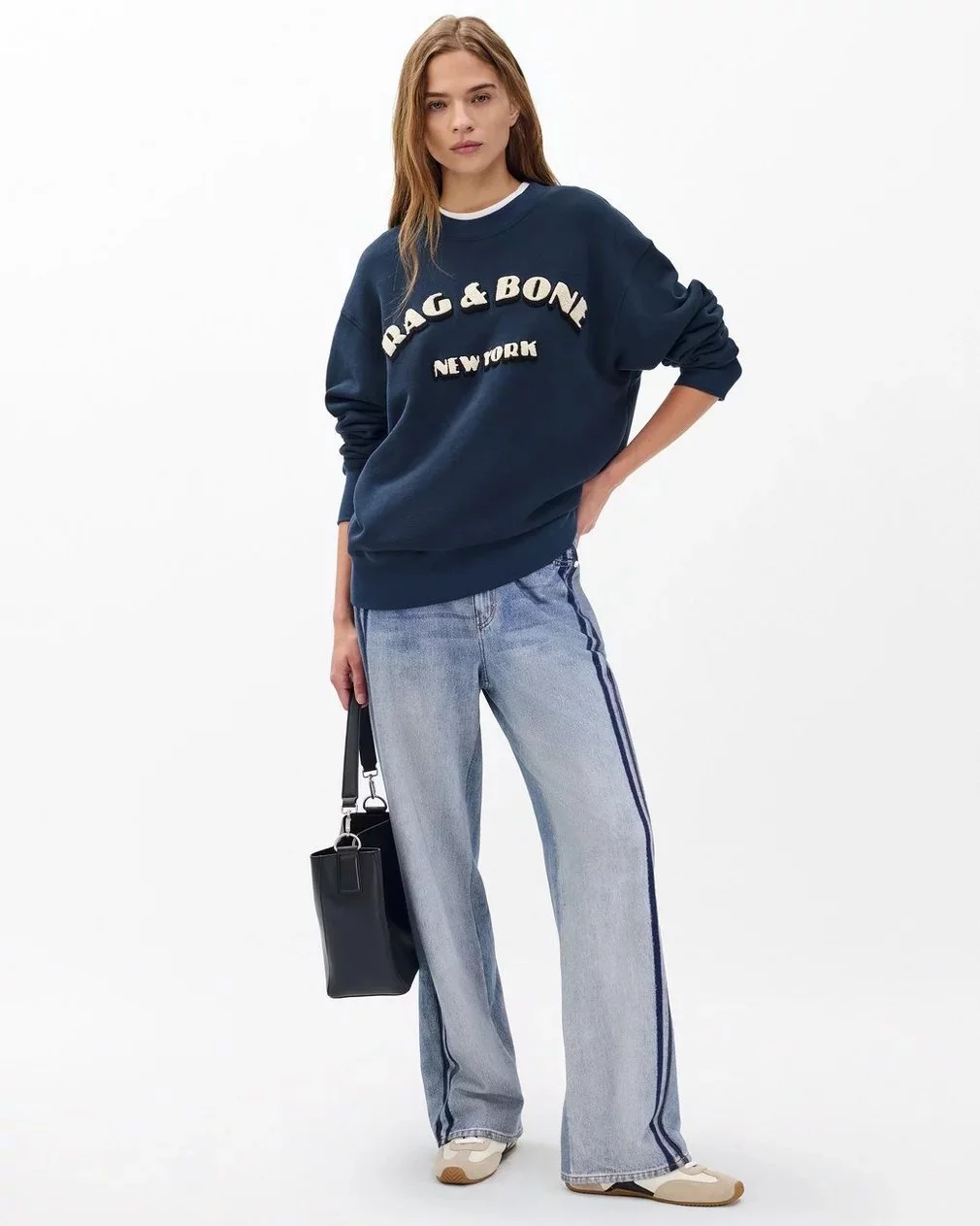 rag and bone lady holding bag