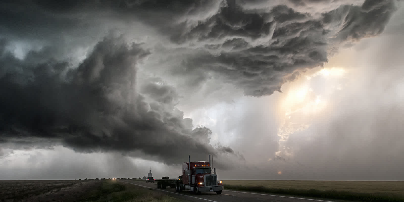 Storm clouds over a truck