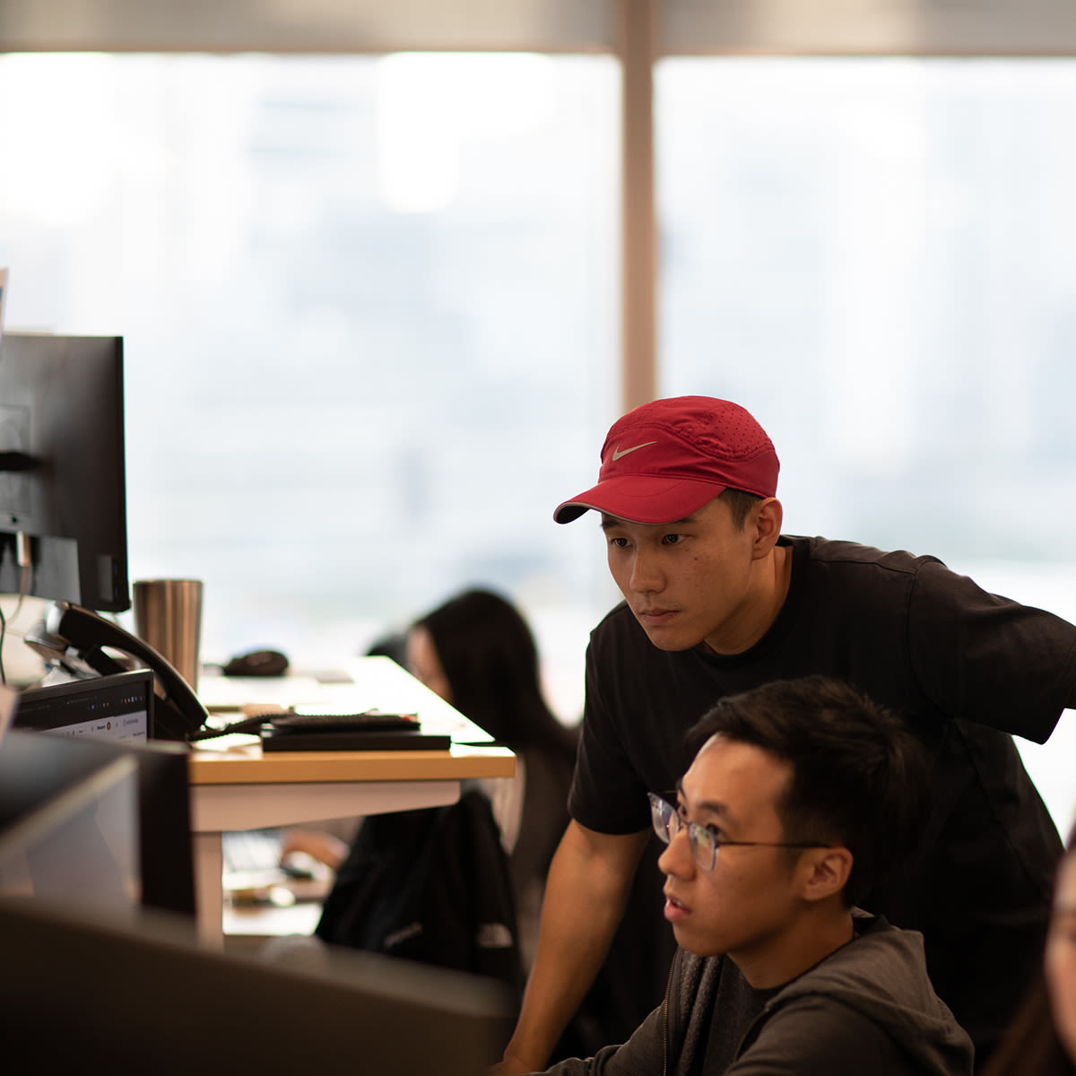 Two people looking at a computer screen