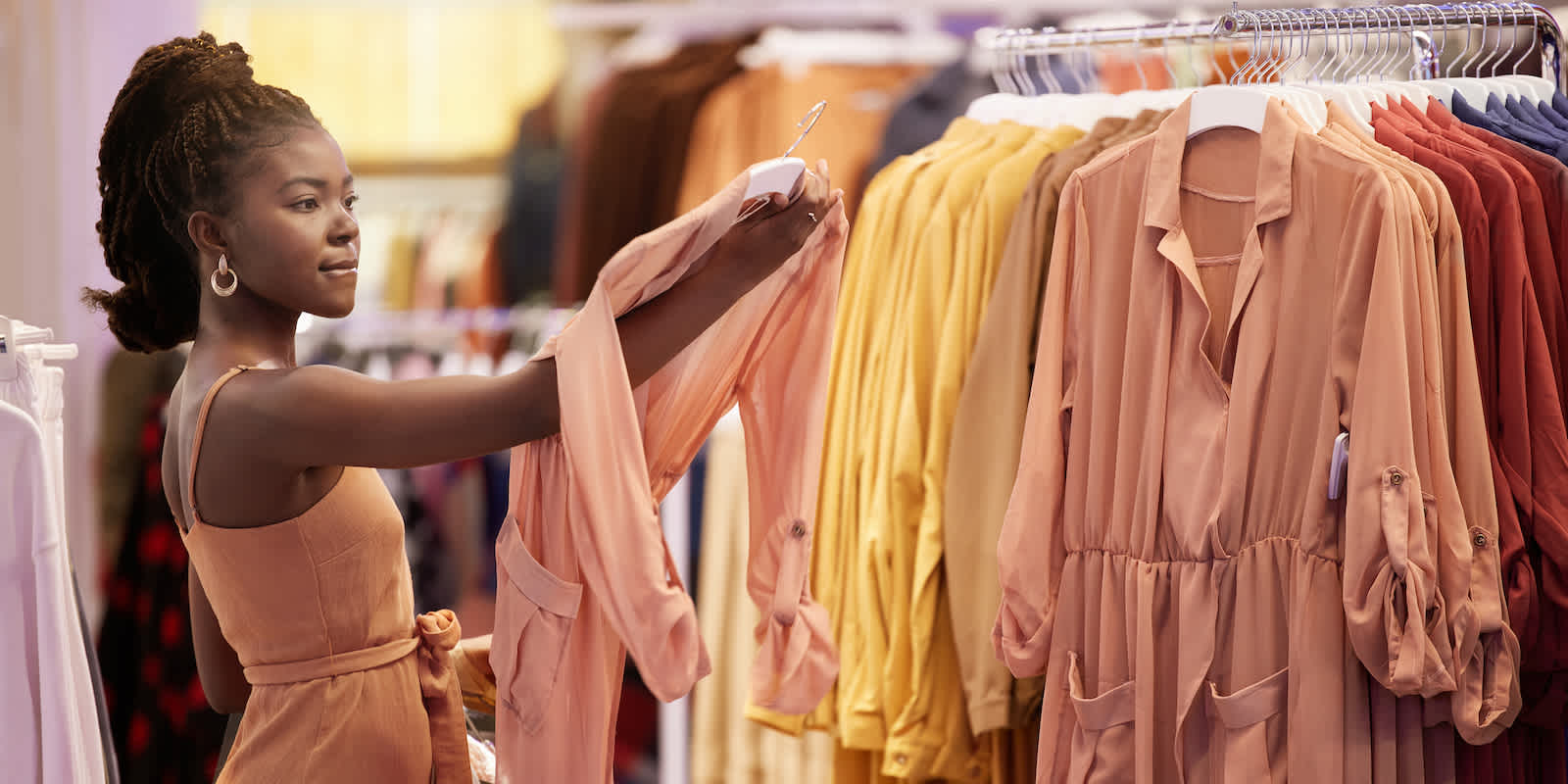 woman with rack of clothes GettyImages 1600x800