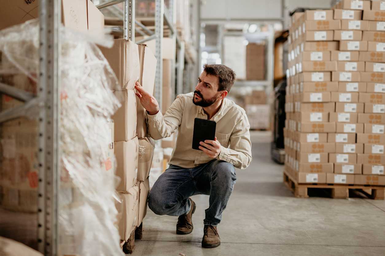 Man in warehouse looking at inventory