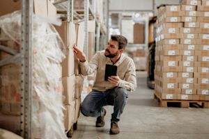 Man in warehouse looking at inventory