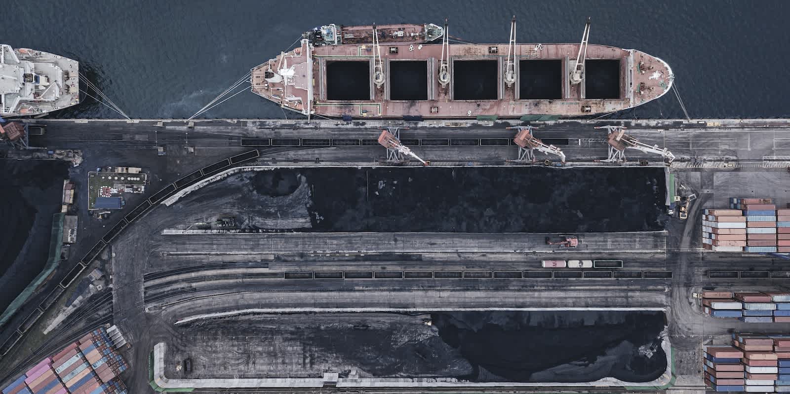 Coal carrier vessel loading at a dock in Vladivostock, Russia