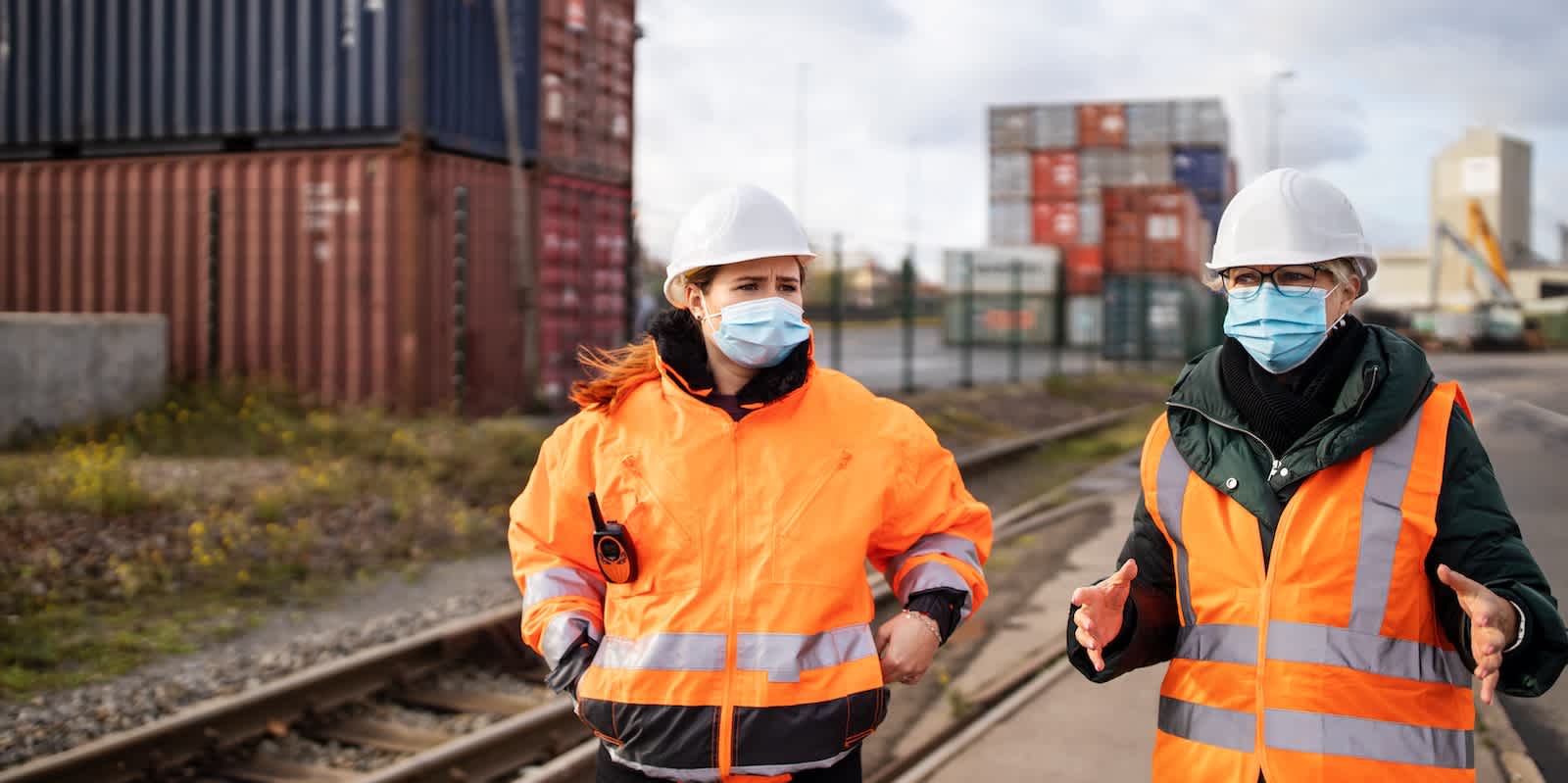 Port workers at a railroad siding