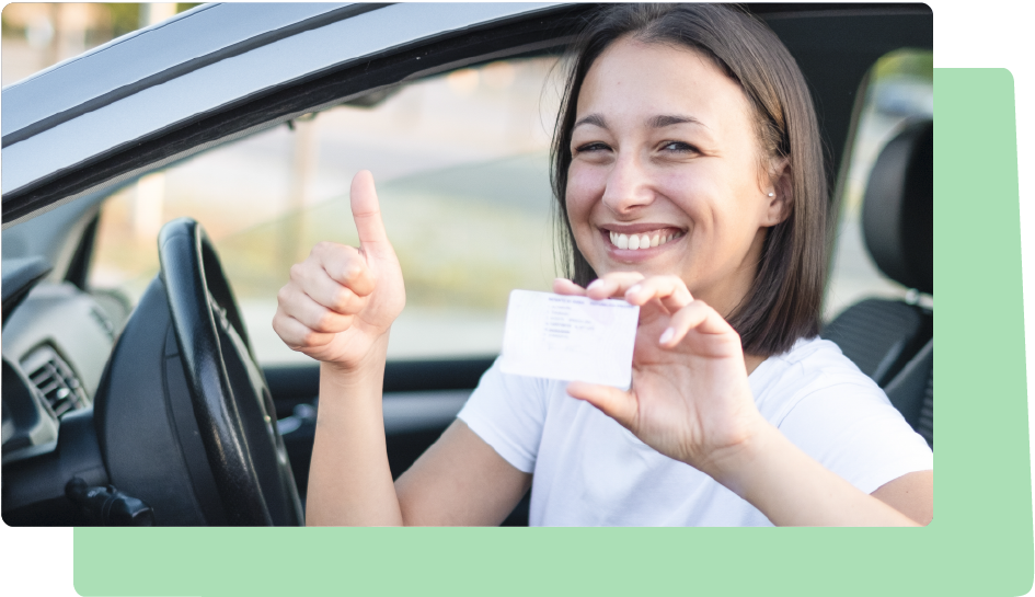 Woman holding Australian licence in car