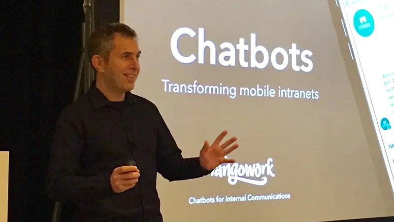 Chris McGrath speaking at a conference about chatbots