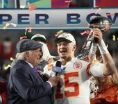 Kansas City Chiefs quarterback Patrick Mahomes (15) holds the the Lombardi Trophy after defeating the Philadelphia Eagles in Super Bowl LVII at State Farm Stadium.