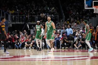 Boston Celtics forward Jayson Tatum (0) reacts after making a long three point shot against the Atlanta Hawks during the second half during game four of the 2023 NBA playoffs at State Farm Arena.