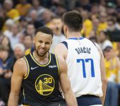 Golden State Warriors guard Stephen Curry (30) celebrates against Dallas Mavericks guard Luka Doncic (77) during the third quarter in game one of the 2022 western conference finals at Chase Center. Mandatory Credit: Kyle Terada-USA TODAY Sports.