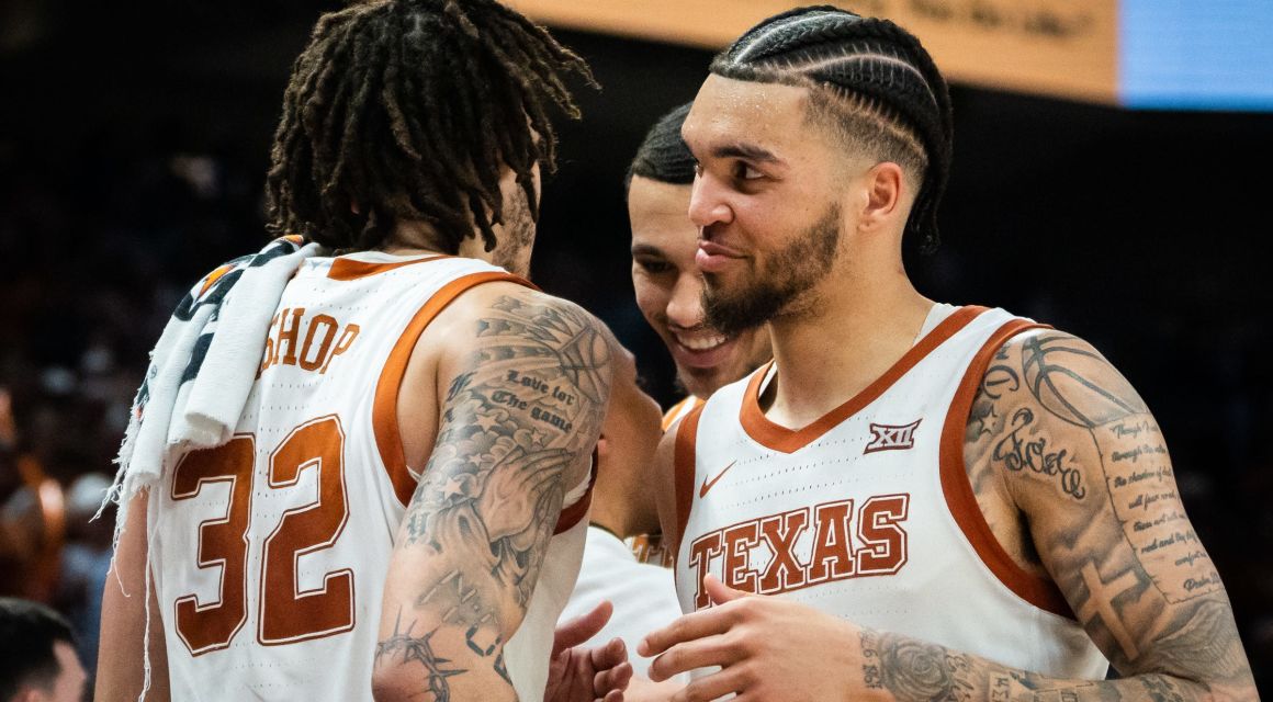 Texas Longhorns senior forward Timmy Allen (0) embraces senior forward Christian Bishop (32) after coming out of the game late in the second half of the Longhorns' game against the University of Kansas Jayhawks at the Moody Center in Austin, Saturday, March 4, 2023.