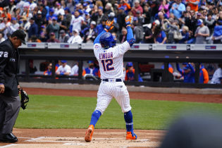 New York Mets designated hitter Francisco Lindor (12) reacts to hitting a home run as he crosses home plate against the San Francisco Giants during the first inning at Citi Field. Mandatory Credit: Gregory Fisher-USA TODAY Sports.