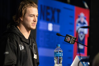 Pittsburgh quarterback Kenny Pickett talks to the media during the 2022 NFL Combine. Mandatory Credit: Trevor Ruszkowski-USA TODAY Sports.